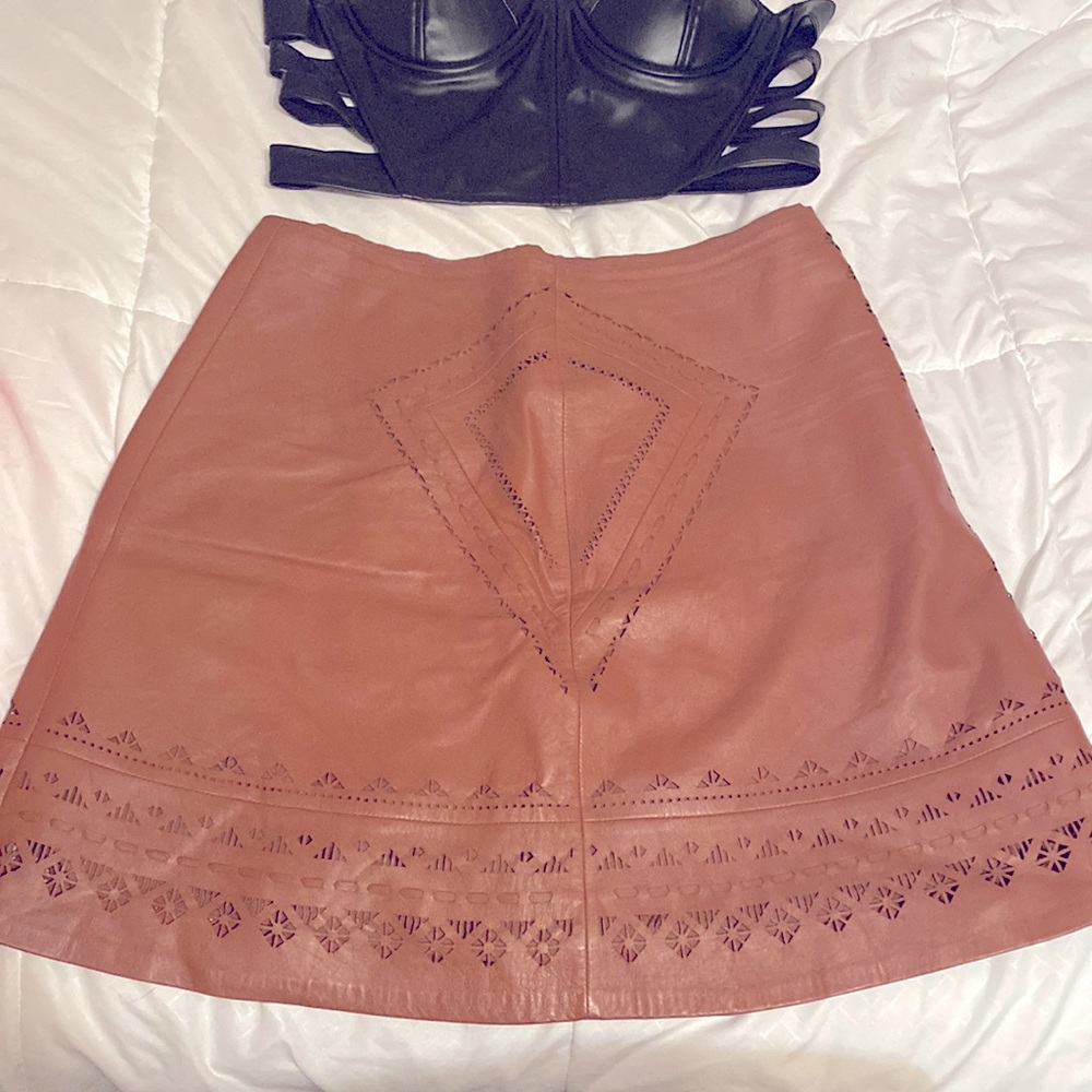 White House Black Market leather laser cut skirt.